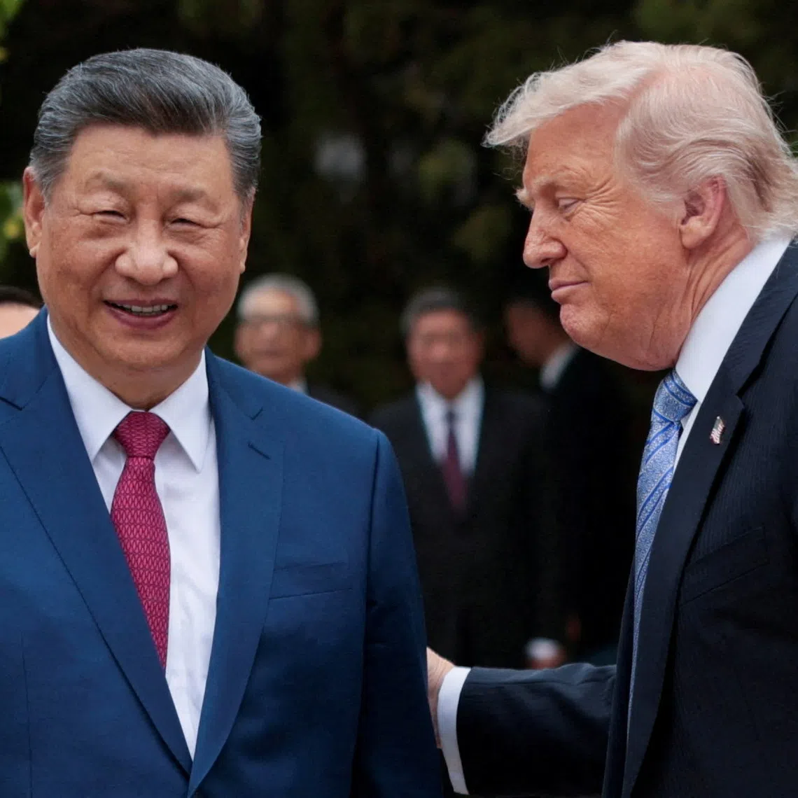 FILE PHOTO: U.S. President Donald Trump speaks with Chinese President Xi Jinping while leaving after a visit to the Zhongnanhai Garden in Beijing, China, May 15, 2026. REUTERS/Evan Vucci/Pool/File Photo