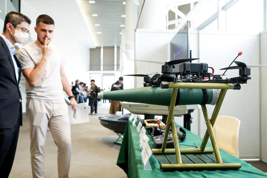 Visitors look at an Overkill Killer FPV one way attack drone displayed during an event held by the National Chung-Shan Institute of Science and Technology in Yilan on June 17.