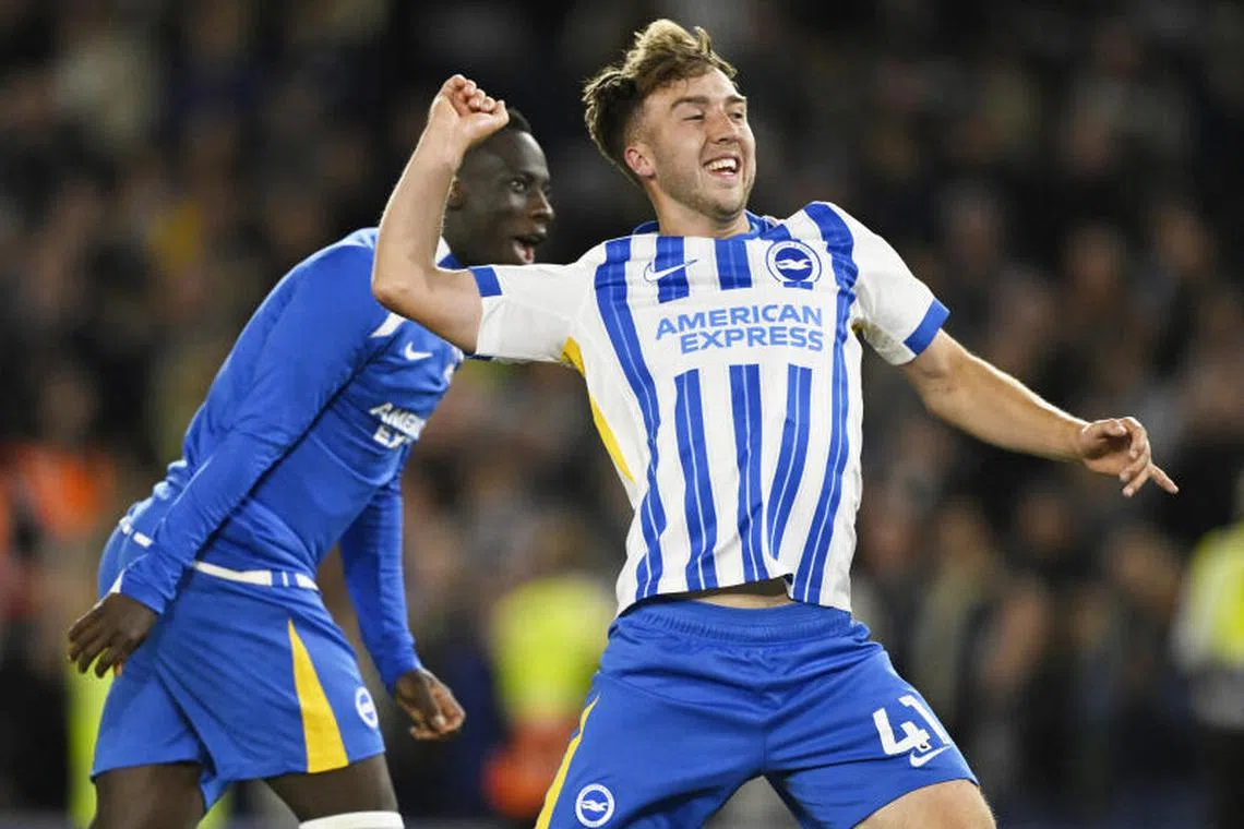 Brighton & Hove Albion's Yankuba Minteh and Jack Hinshelwood celebrate after the match.