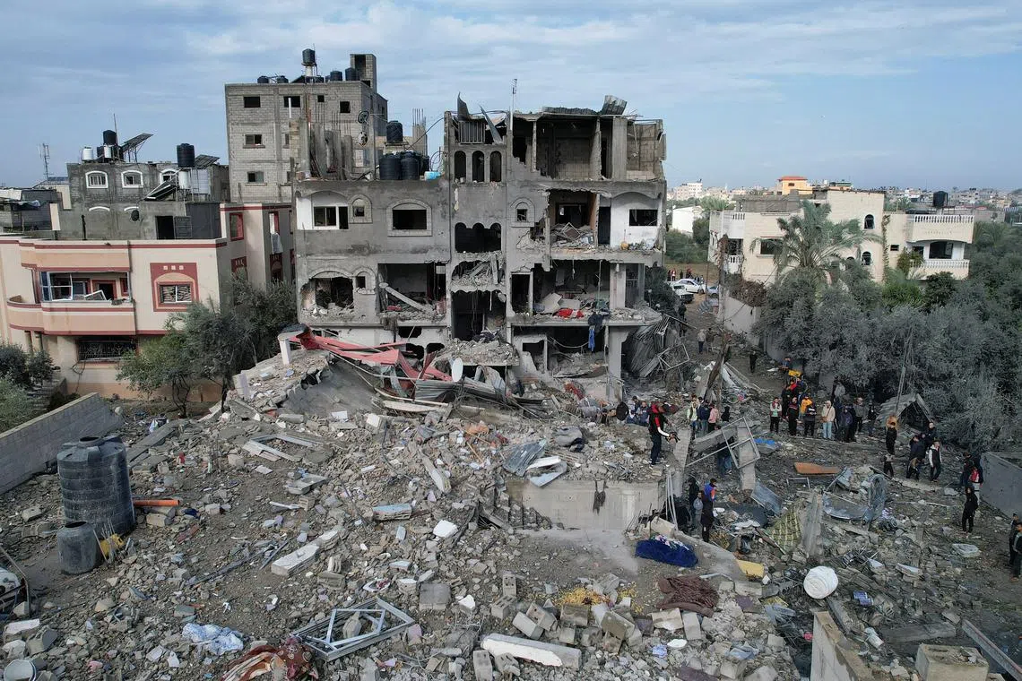 The site of Israeli strikes on houses at the al-Maghazi refugee camp in the central Gaza Strip on Dec 25.