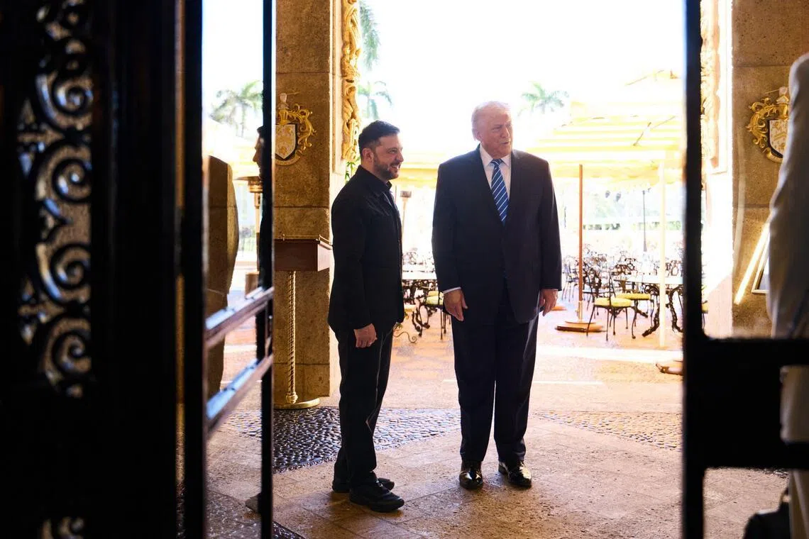 US President Donald Trump (right) welcoming Ukrainian President Volodymyr Zelensky to his Mar-a-Lago estate in Palm Beach, Florida, on Dec 28.