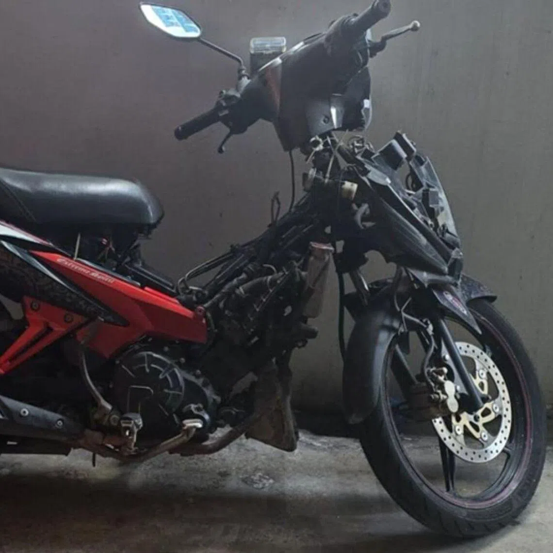 The motorcycle was parked at a building in Woodlands Close.