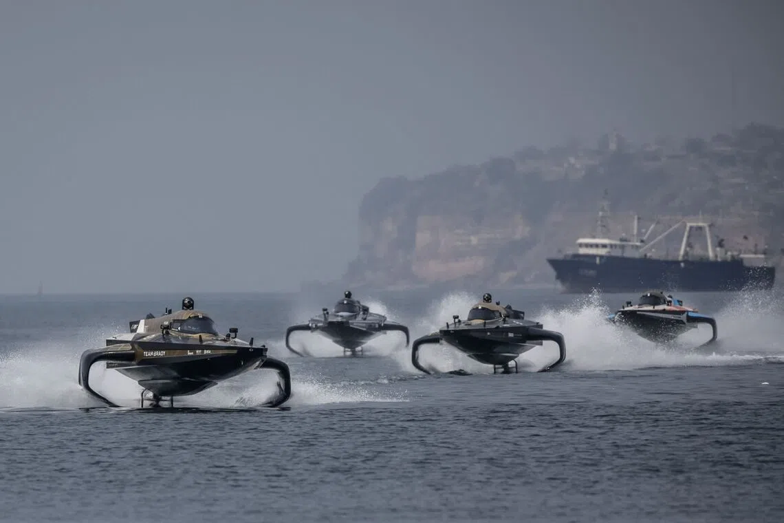 TOPSHOT - Electric raceboats compete in the race off during the E1 Luanda GP 2026 World Championship at the Marina Baia in Luanda on September 13, 2026. (Photo by Phill Magakoe / AFP)