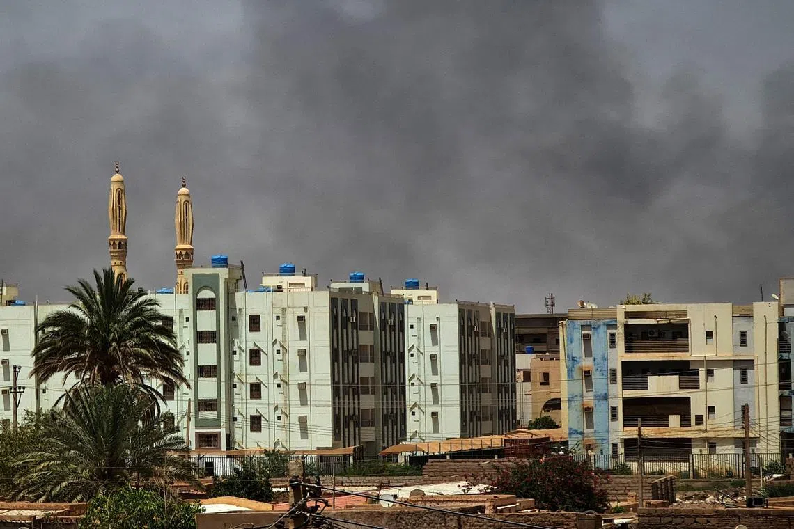 Smoke billows in Sudan's capital Khartoum on May 27, five days into a one-week ceasefire.