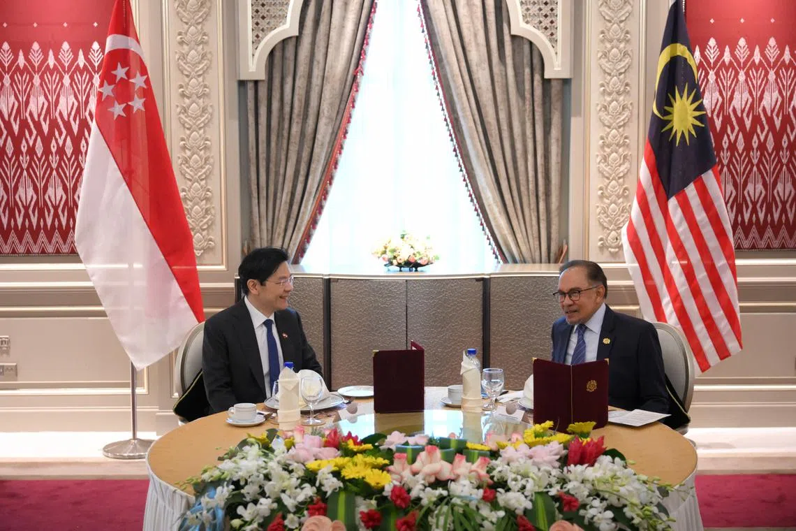 Prime Minister Lawrence Wong and Malaysian Prime Minister Anwar Ibrahim at the Seri Perdana in Putrajaya on June 12, 2024.