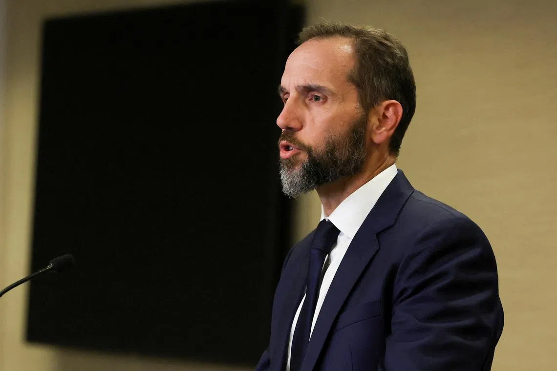FILE PHOTO: U.S. Special Counsel Jack Smith makes a statement to reporters after a grand jury returned an indictment of former U.S. President Donald Trump in the special counsel's investigation of efforts to overturn his 2020 election defeat, at Smith's offices in Washington, U.S., August 1, 2023. REUTERS/Kevin Wurm/File Photo