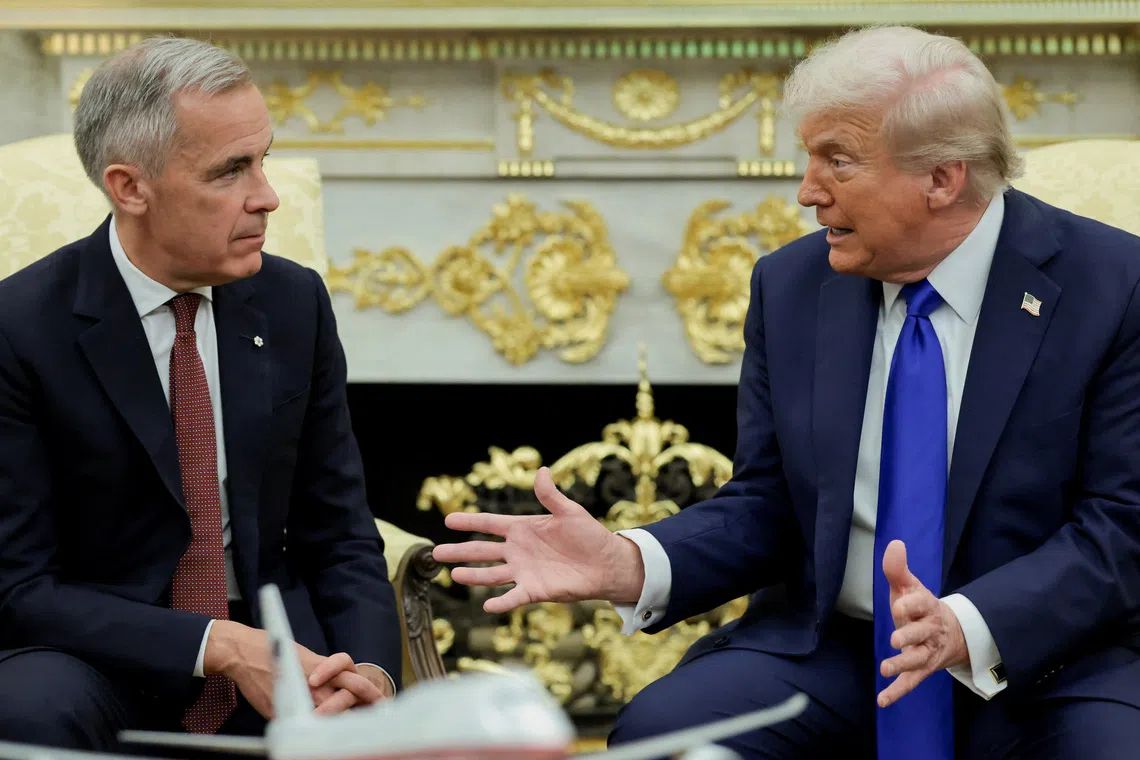 U.S. President Donald Trump and Canada's Prime Minister Mark Carney meet in the Oval Office at the White House in Washington, D.C., U.S., October 7, 2025. REUTERS/Evelyn Hockstein