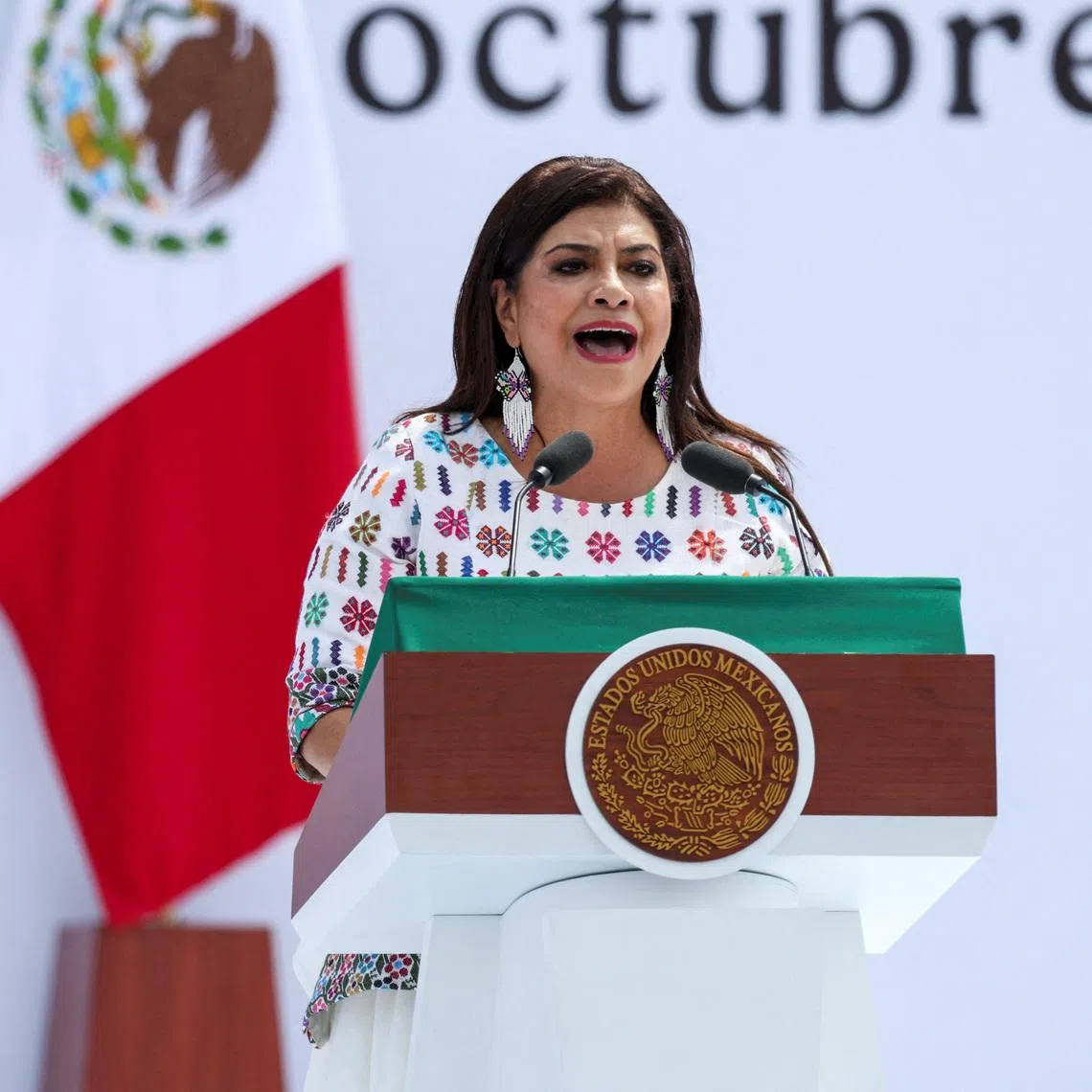 Mexico City Mayor Clara Brugada speaks on stage, on the day Mexico's President Claudia Sheinbaum delivers a speech marking her first year in office, reporting on government actions included in her first State of the Union address, to supporters and government officials at Zocalo Square, in Mexico City, Mexico, October 5, 2025. REUTERS/Toya Sarno Jordan