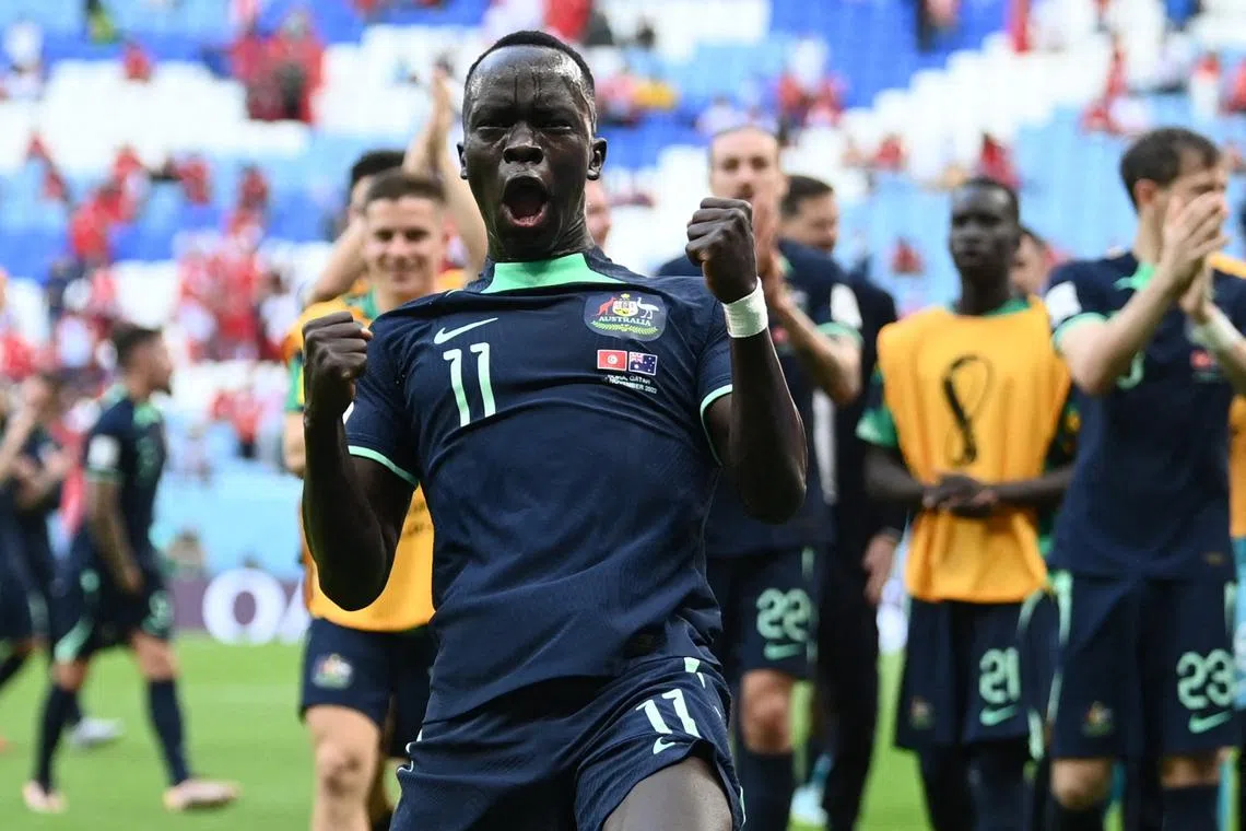 FILE PHOTO: Soccer Football - FIFA World Cup Qatar 2022 - Group D - Tunisia v Australia - Al Janoub Stadium, Al Wakrah, Qatar - November 26, 2022 Australia's Awer Mabil celebrates after the match REUTERS/Annegret Hilse/File Photo