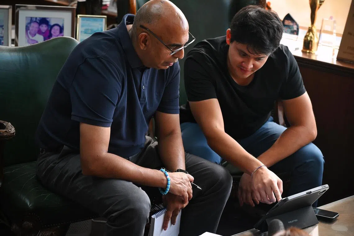 Joseph Schooling watching his race in 2016 with Rohit Brijnath.