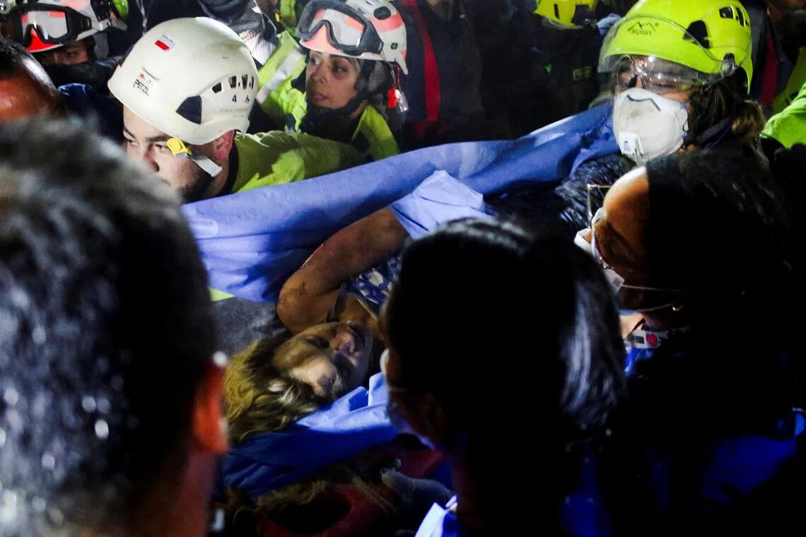 Woman rescued from rubble of Colombia quake dies