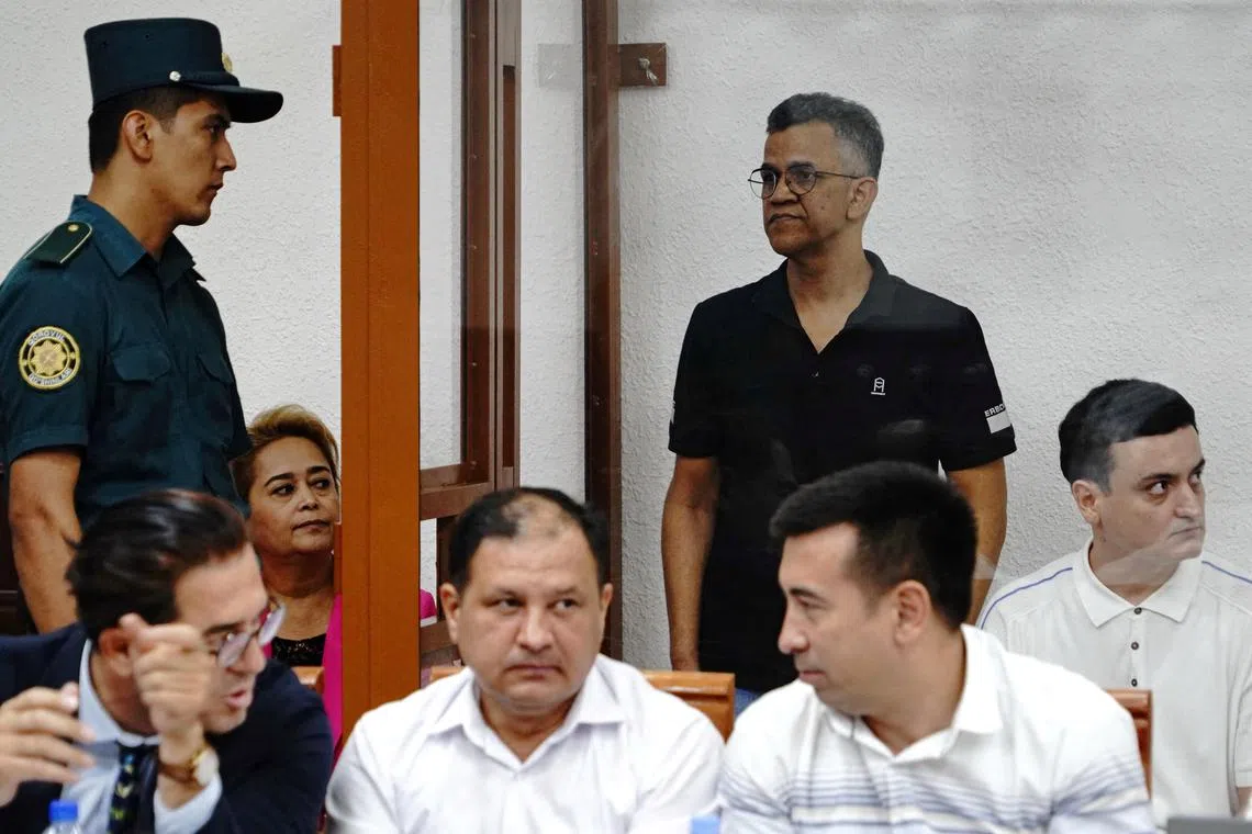 FILE PHOTO: Defendant Singh Raghvendra Pratar, an executive of Quramax Medical, a company that sold medicines produced by India's Marion Biotech in Uzbekistan, stands inside an enclosure for defendants during a court hearing in the case of child deaths linked to contaminated cough syrups, in Tashkent, Uzbekistan August 16, 2023. REUTERS/Stringer/File Photo