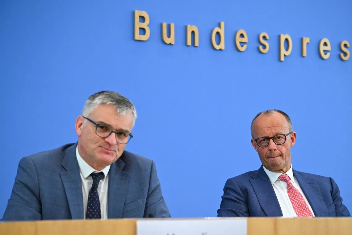 German Federal Government Spokesperson Stefan Kornelius and Chancellor Friedrich Merz attend a press conference about domestic and foreign policy issues in Berlin, Germany, July 15, 2026. REUTERS/Annegret Hilse