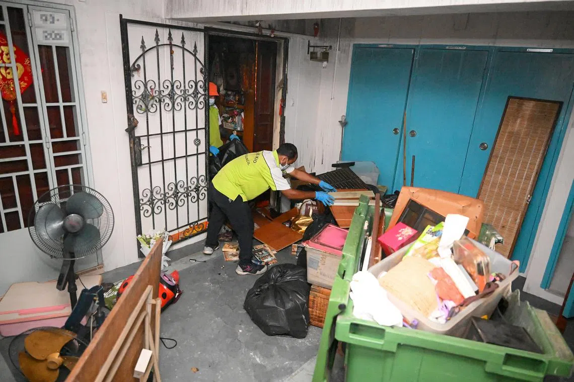 Town council staff clearing items from the flat on Jan 10. 