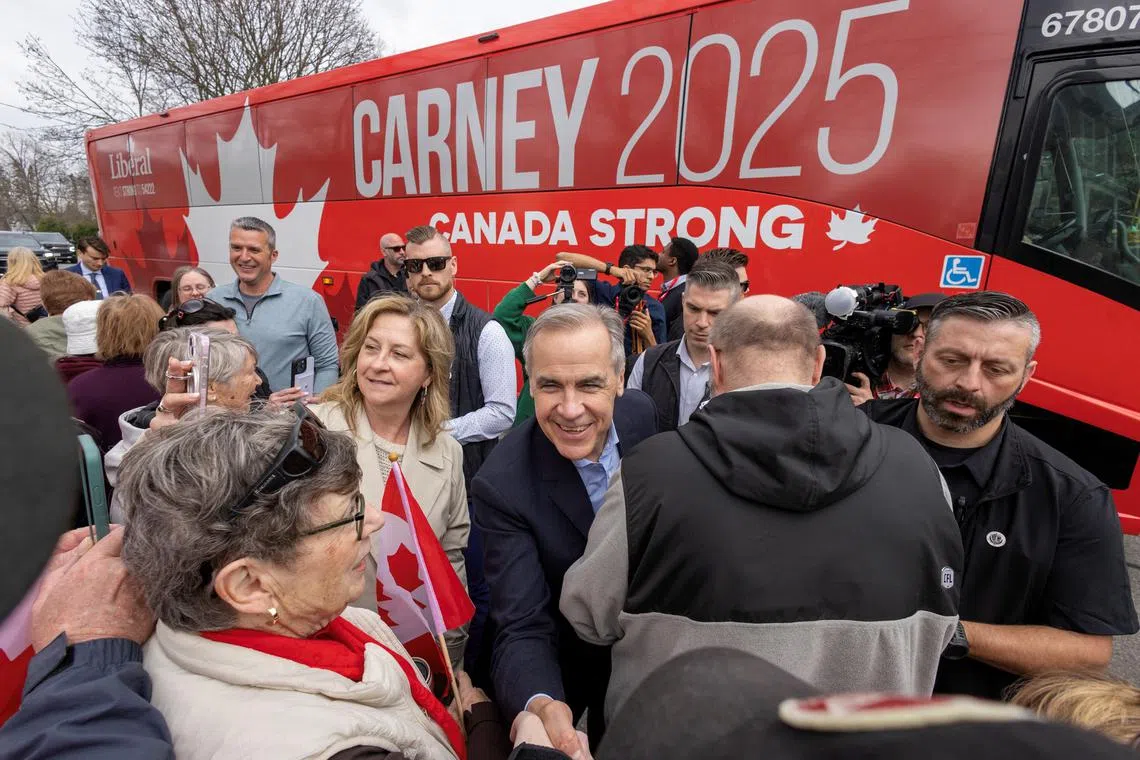 Canadian Prime Minister Mark Carney greeting supporters during his Liberal Party election campaign tour in Newcastle, Ontario, on April 19.