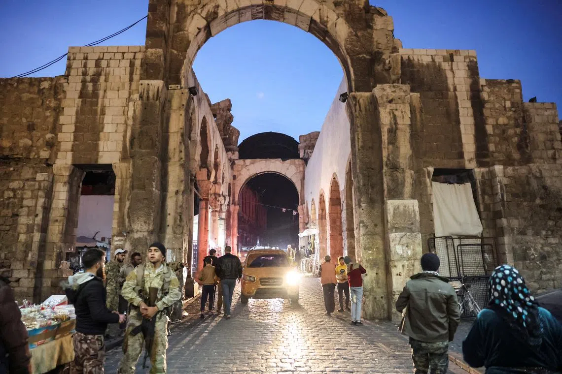 People walk, after rebels seized the capital and ousted Syria's Bashar al-Assad, in Damascus, Syria December 9, 2024. REUTERS/Mohamed Azakir/File Photo