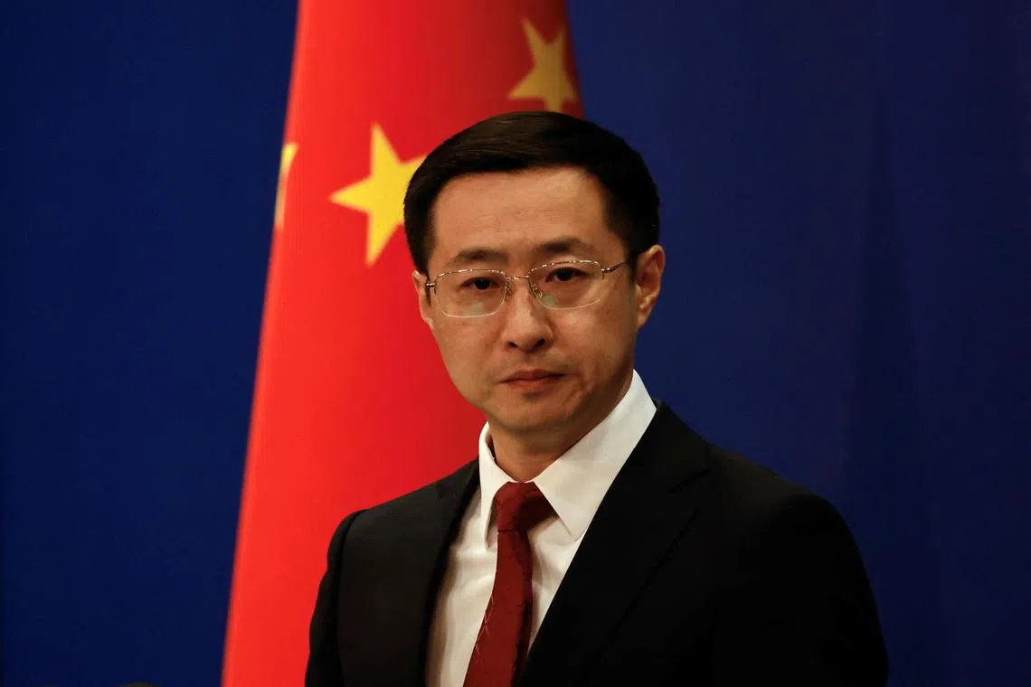Chinese Foreign Ministry spokesperson Lin Jian attends a press conference in Beijing, China April 10, 2025. REUTERS/Tingshu Wang/File Photo
