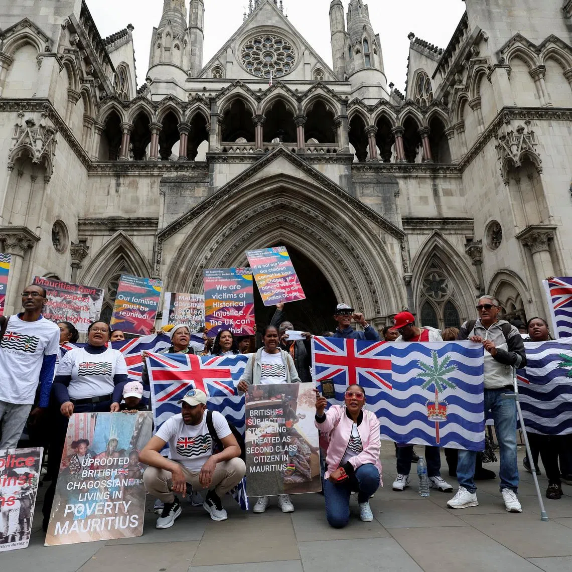 Members of the British Chagossian community demonstrate, as they wait to hear the outcome of a court injunction that temporarily blocked the UK from concluding Chagos Islands deal with Mauritius, outside the High Court in London, Britain, May 22, 2025. REUTERS/Suzanne Plunkett