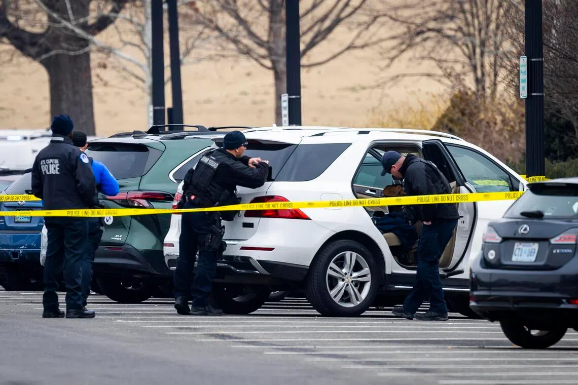 US Capitol police searching a vehicle on Feb 17 in the vicinity of the Capitol in Washington DC, after a young man running towards the building with a shotgun was arrested.