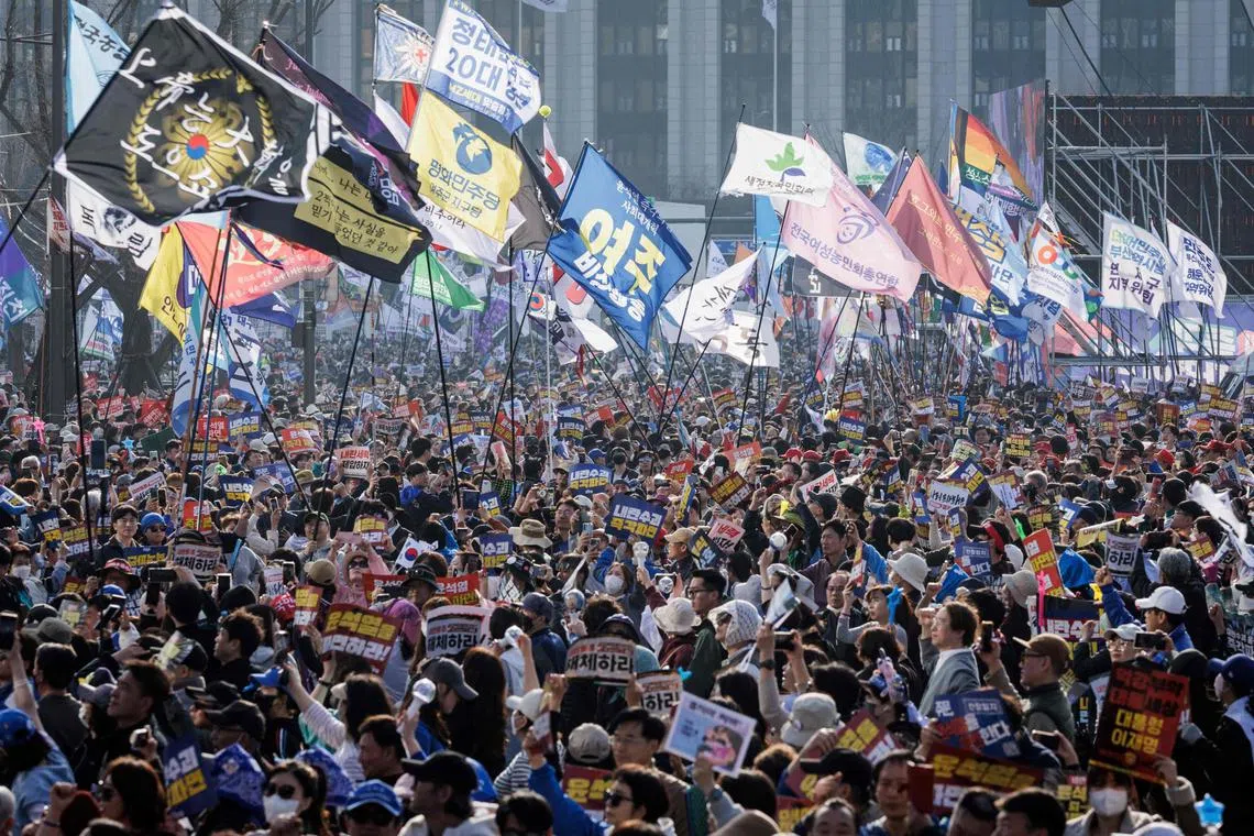 Protesters attend a demonstration against impeached South Korean President Yoon Suk Yeol in Seoul on March 22, 2025.