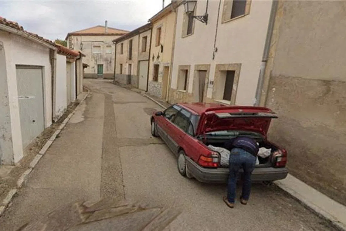 A Google Street View picture, which Spanish police used as part of a missing person investigation, shows a man placing what appears to be a bag with a body in a car's trunk, in Tajueco, Spain, in this picture dated October 2024 and obtained by Reuters on December 19, 2024. Courtesy Google Street View/Handout via REUTERS THIS IMAGE HAS BEEN SUPPLIED BY A THIRD PARTY. NO RESALES. NO ARCHIVES. MANDATORY CREDIT TPX IMAGES OF THE DAY