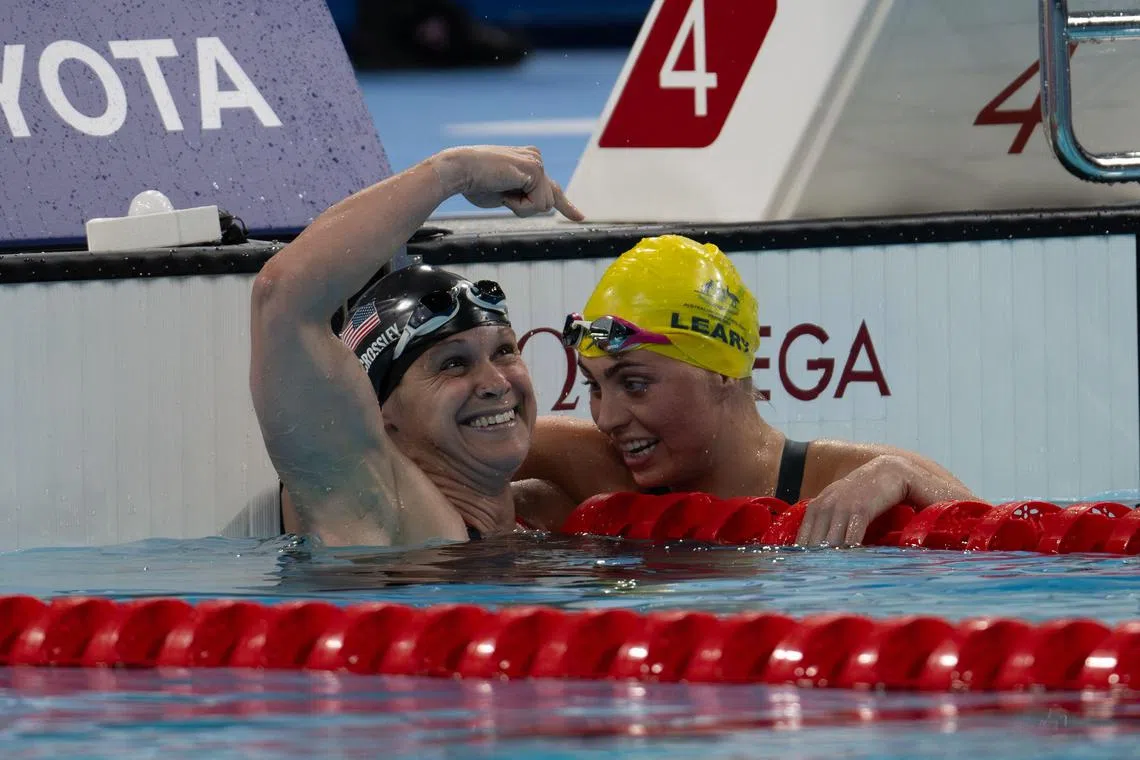 American silver medallist Christie Raleigh-Crossley and gold medallist Alexa Leary of Australia celebrate after competing in the S9 Women's 100m freestyle swimming event of the Paris Paralympics on Sept 4.
