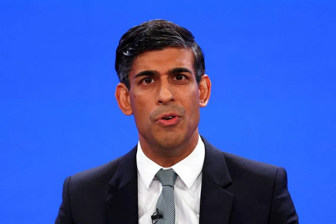 British Prime Minister Rishi Sunak speaks on stage at Britain's Conservative Party's annual conference in Manchester, Britain, October 4, 2023. REUTERS/Toby Melville