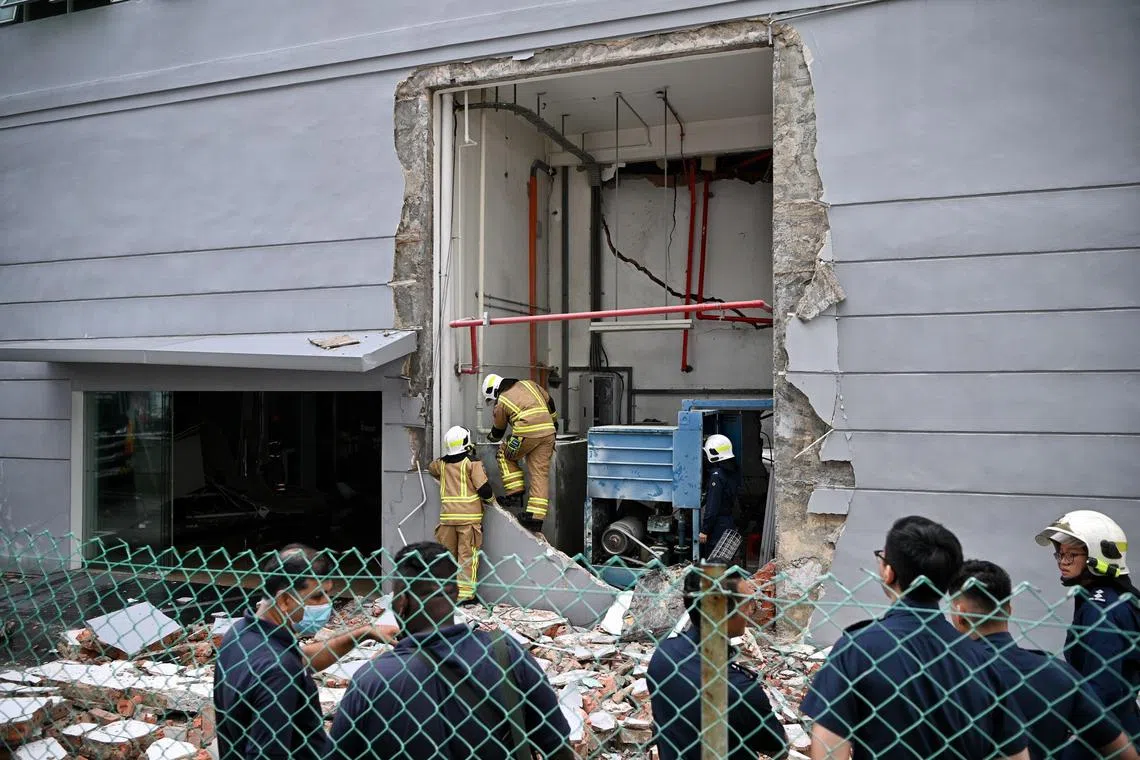 An explosion blew open a section of the Audi service centre in Ubi on March 7, 2023. 