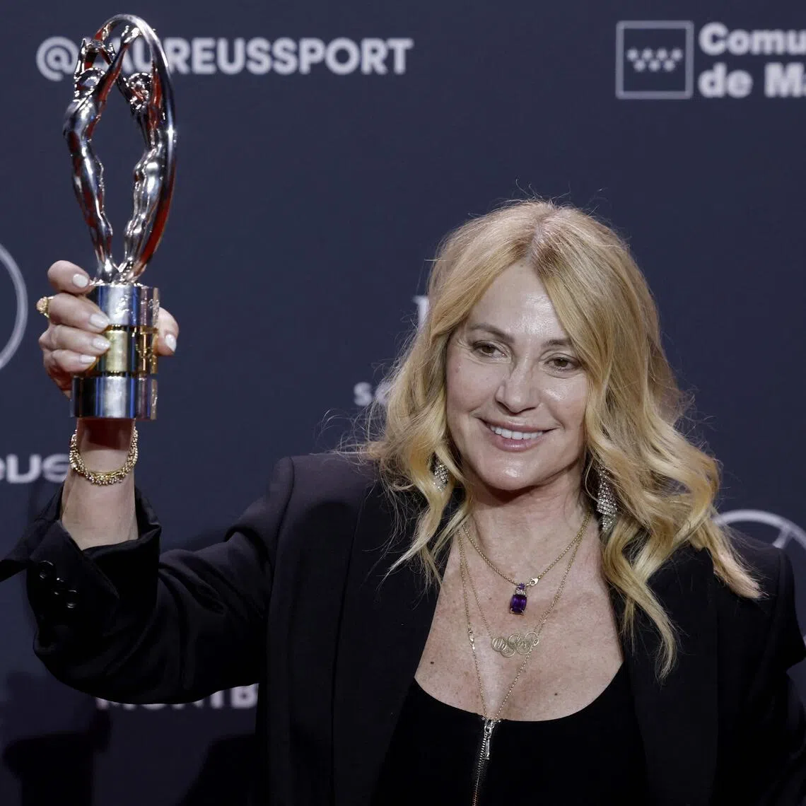 Former Romanian gymnast Nadia Comaneci poses with her Life Achievement Award during the 27th Laureus World Sports Awards gala in Madrid on April 20, 2026. 