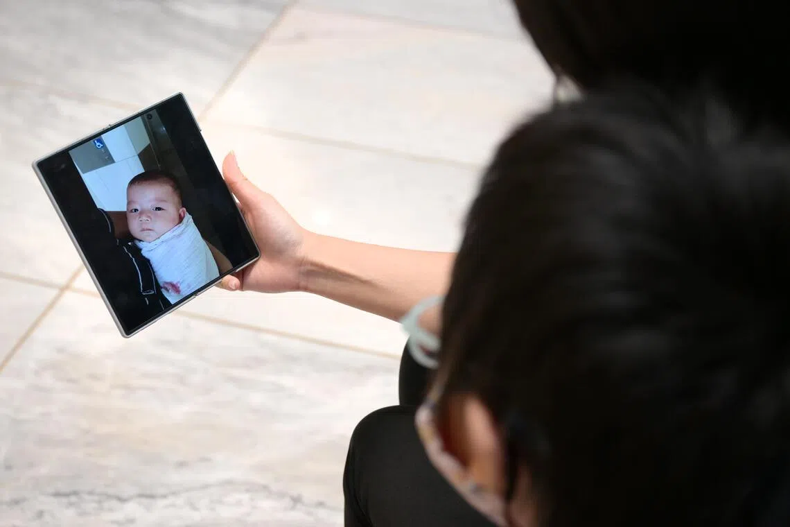 An 11 year-old Singaporean, known here as Adrian, is the first paediatric patient with GNAO1, a rare genetic neurological disorder, in Singapore and  Asia to undergo Deep Brain Stimulation surgery for this condition. Adrian (with his back and his mother Felicia, 42, looking at a baby photo of Adrian.