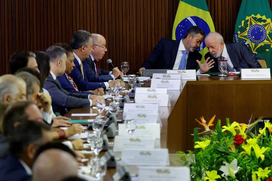Brazil's President Luiz Inacio Lula da Silva talks with Brazil's Lower House Speaker Arthur Lira during a meeting on installation of the G20 National Commission at the Planalto Palace in Brasilia, Brazil November 23, 2023. REUTERS/Ueslei Marcelino/File Photo