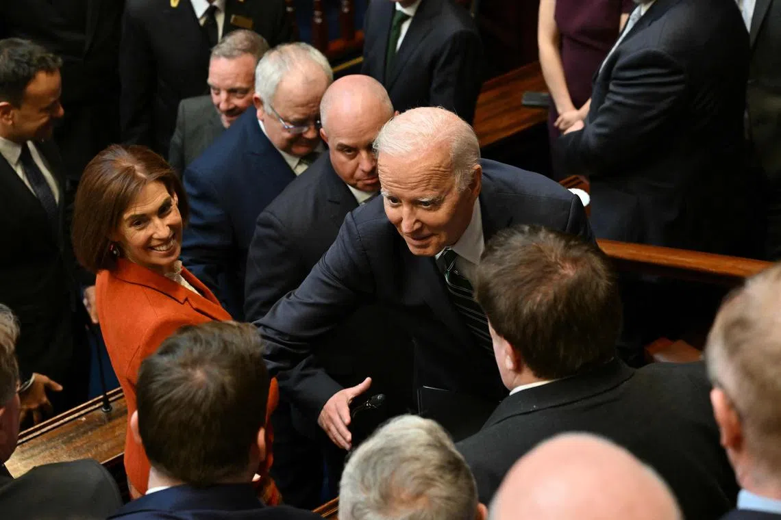 US President Joe Biden greets Irish lawmakers after addressing the Irish parliament, at Leinster House in Dublin.