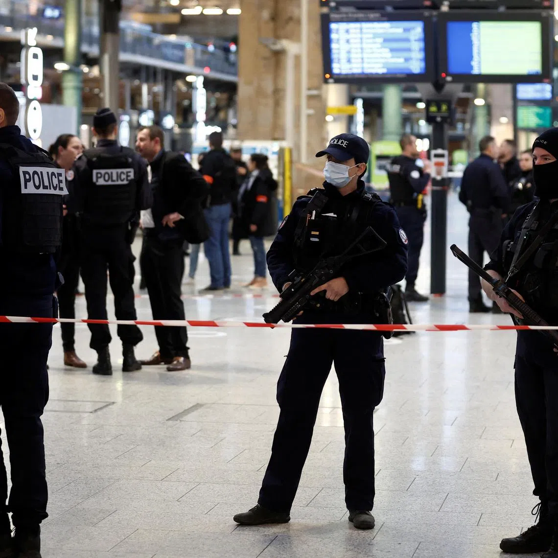 French police secure the area after a man with a knife wounded several people at the Gare du Nord train station on Jan 11. 