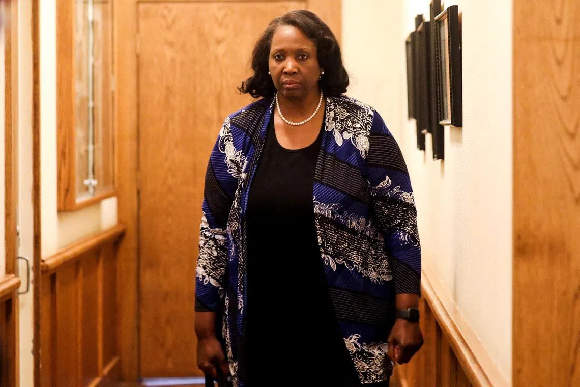 FILE PHOTO: Federal Reserve Governor Lisa Cook attends the Federal Reserve Bank of Kansas City's 2025 Jackson Hole economic symposium, \"Labor Markets in Transition: Demographics, Productivity, and Macroeconomic Policy\" in Jackson Hole, Wyoming, U.S., August 23, 2025. REUTERS/Jim Urquhart/File Photo