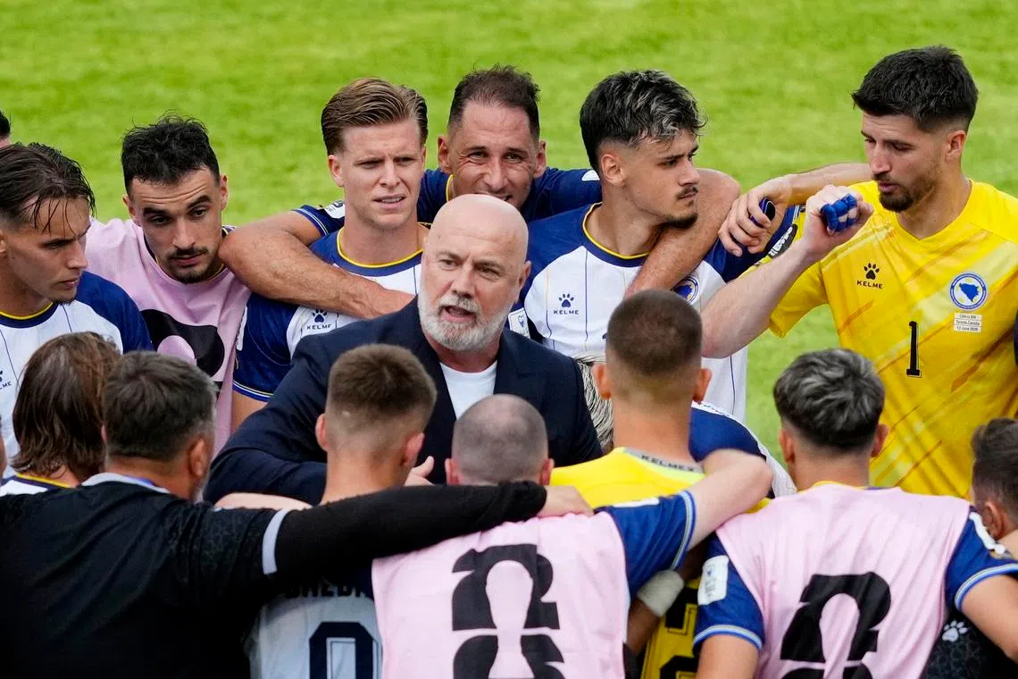 Bosnia and Herzegovina coach Sergej Barbarez talking to his players after the match.