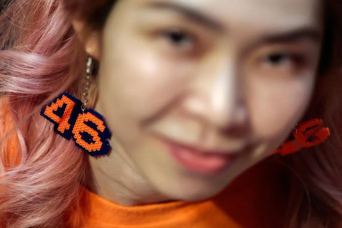 A supporter of the People's Party wearing an earring with the number 46, the party's list number, attending a general election campaign rally ahead of Thailand's general election, in Bangkok, Thailand, on Jan 25, 2026. 