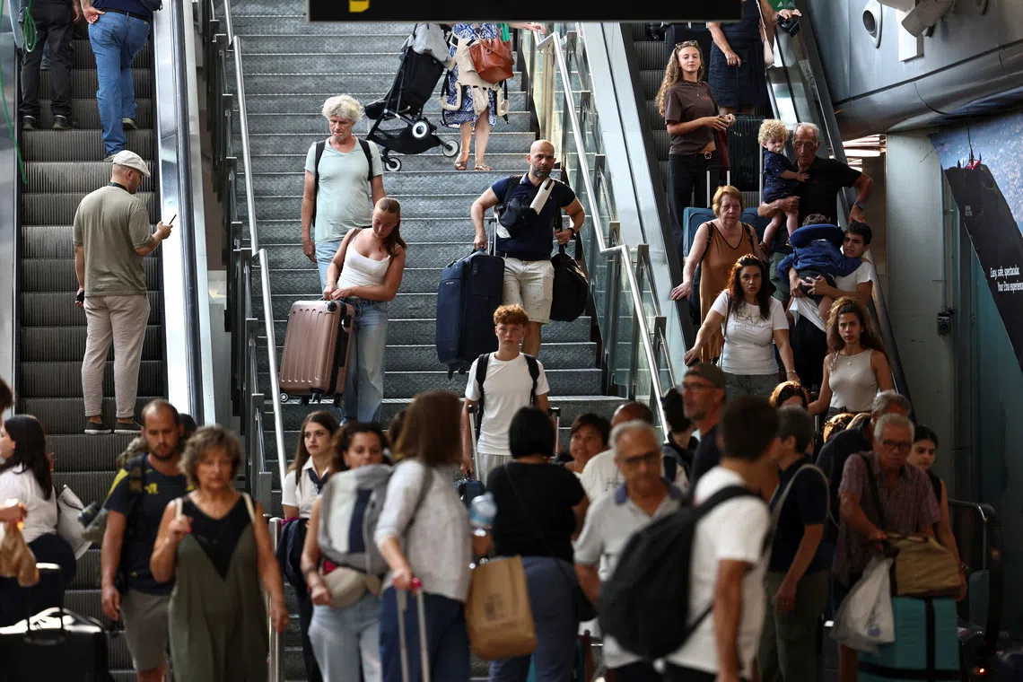 Passengers at Catania Airport following the closure of the airport due to an ash cloud from Sicily’s Mount Etna.
