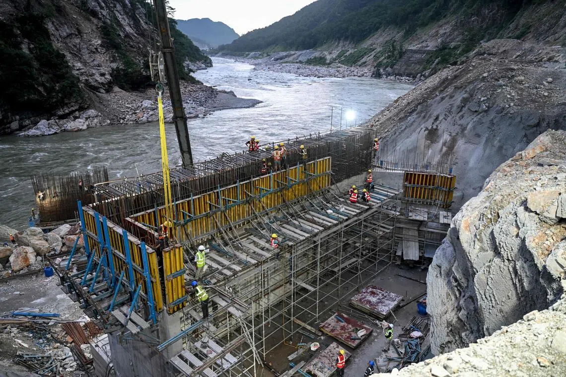 Labourers working at the under-construction site of the Dibang Multi-purpose Hydroelectric Project on the Dibang river, in the northeastern state of Arunachal Pradesh, on Aug 22.