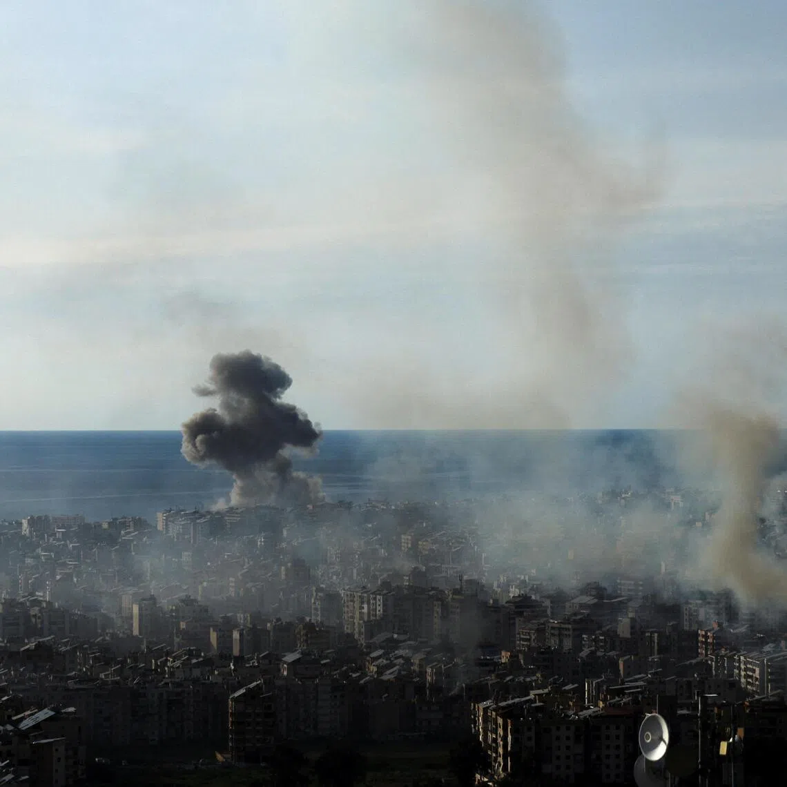 Smoke rises over Beirut’s southern suburbs following an air strike by Israeli forces against the Iran-backed militant group Hezbollah.