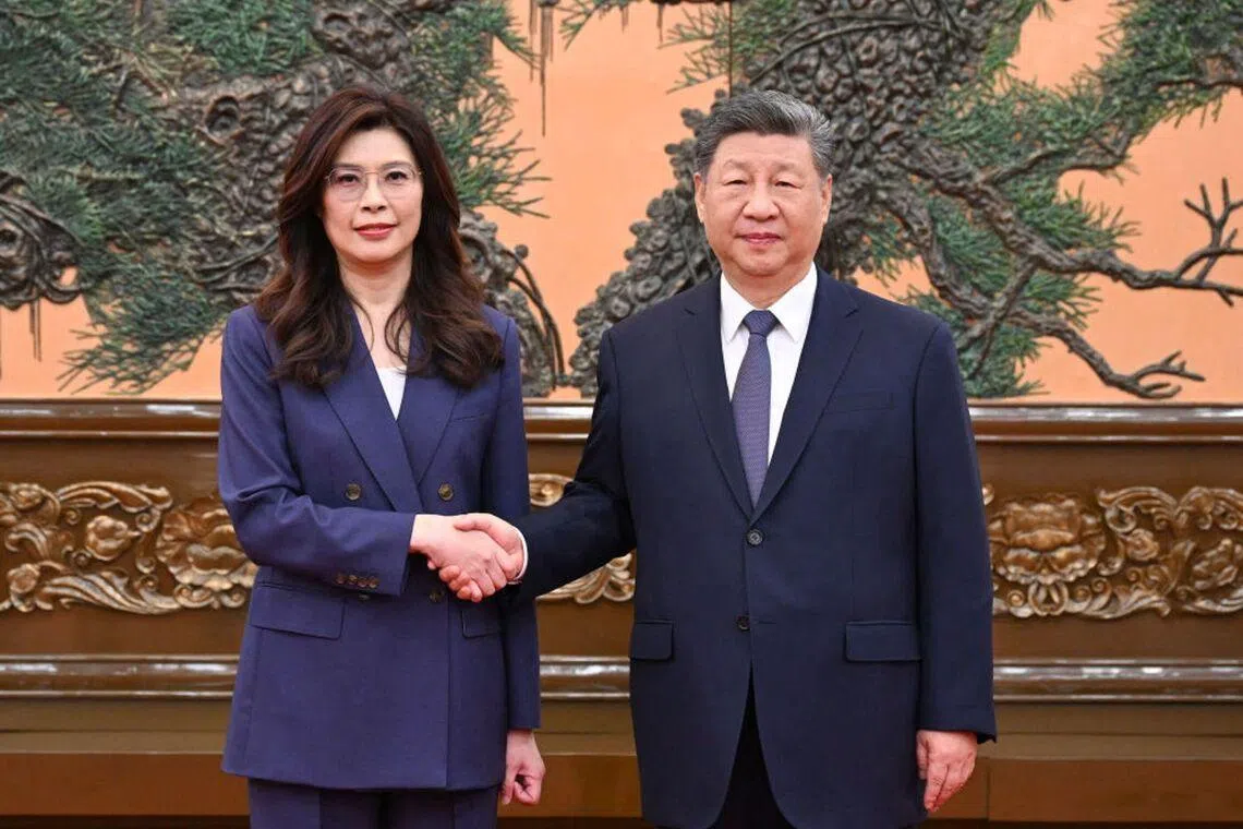 This is a handout photo taken and released on April 10, 2026, by the office of Kuomintang (KMT) shows Kuomintang Chairperson Cheng Li-wun (L) shaking hands with Chinese President Xi Jinping (R) at Great Hall of the People in Beijing. Xi told Cheng as the two met that "the general trend of compatriots on both sides of the Strait getting closer, edging nearer and becoming united will not change". (Photo by Handout / The Office of Kuomintang (KMT) lawmaker Johnny Chiang / AFP) / --- EDITORS NOTE --- RESTRICTED TO EDITORIAL USE - MANDATORY CREDIT "AFP PHOTO / The Office of Kuomintang (KMT)" - NO MARKETING NO ADVERTISING CAMPAIGNS - DISTRIBUTED AS A SERVICE TO CLIENTS - NO ARCHIVES