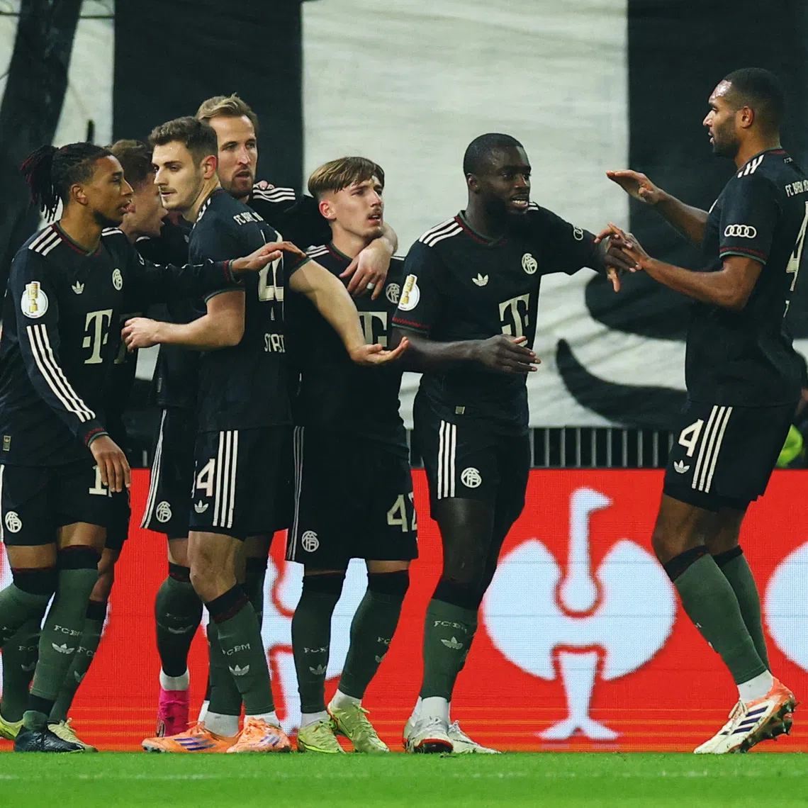 Soccer Football - DFB Cup - Round of 16 - 1. FC Union Berlin v Bayern Munich - Stadion An der Alten Forsterei, Berlin, Germany - December 3, 2025 Bayern Munich players celebrate their first goal, an own goal scored by 1. FC Union Berlin's Ilyas Ansah REUTERS/Lisi Niesner