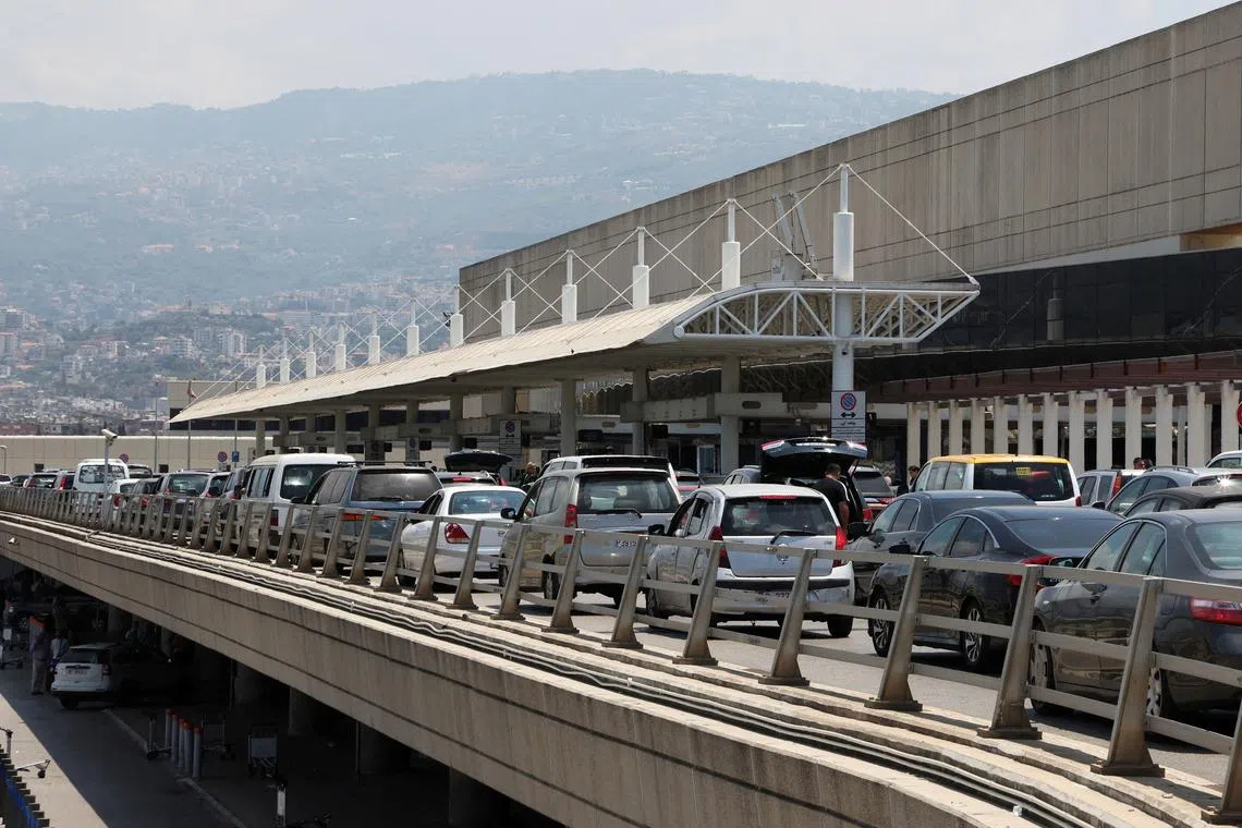 FILE PHOTO: Cars queue as they drop passengers outside the Beirut–Rafic Hariri International Airport, in Beirut, Lebanon July 30, 2024. REUTERS/Mohamed Azakir/File Photo