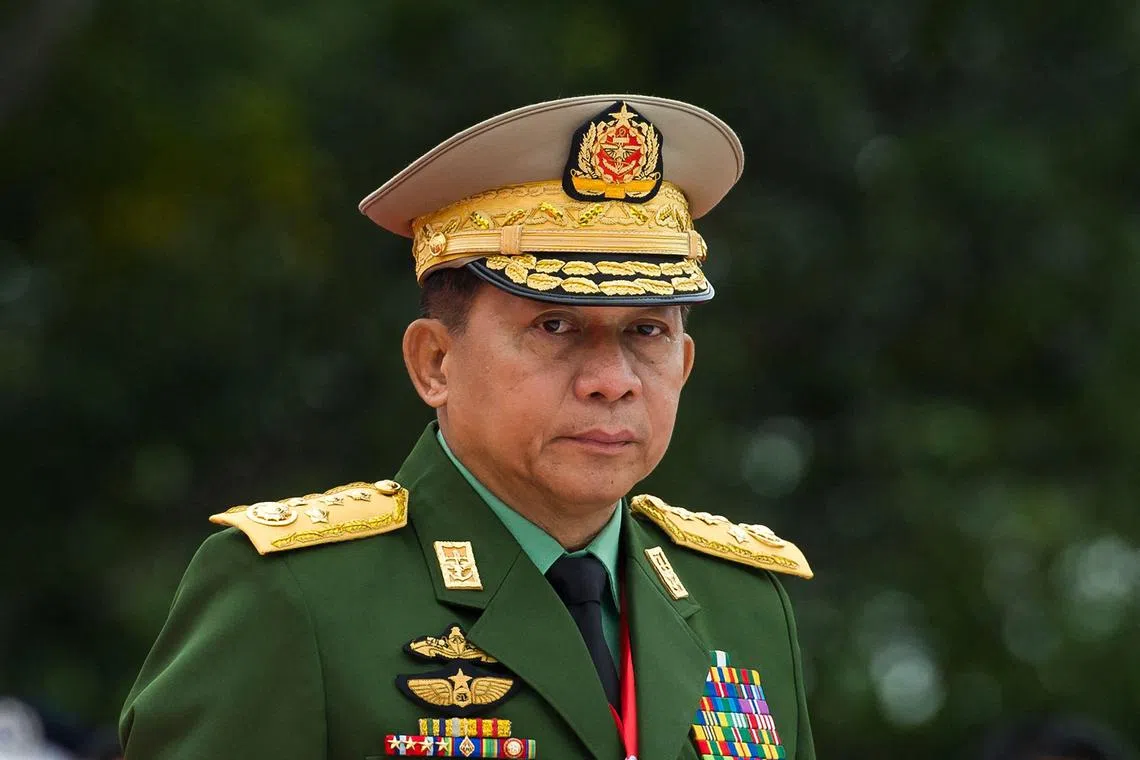 (FILES) Myanmar's Chief Senior General Min Aung Hlaing, commander-in-chief of the Myanmar armed forces, arrives for a ceremony to mark the 71th anniversary of Martyrs' Day in Yangon on July 19, 2018. Myanmar's military on August 14, 2024 said rumours top generals had detained the embattled junta chief in a new coup were "propaganda" spread by "traitors" ahead of a vist by China's foreign minister. (Photo by YE AUNG THU / AFP)
