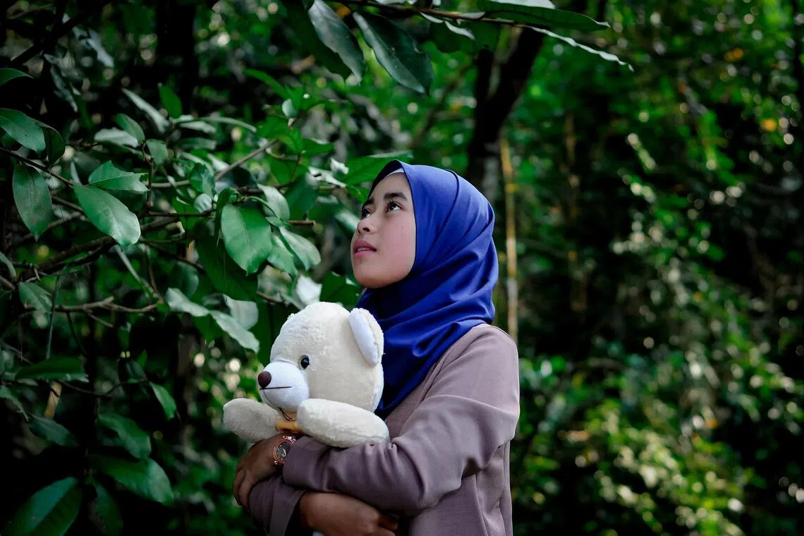 The law prevents girls younger than 14 from wearing headscarves that “cover the head in accordance with Islamic traditions” in all schools.