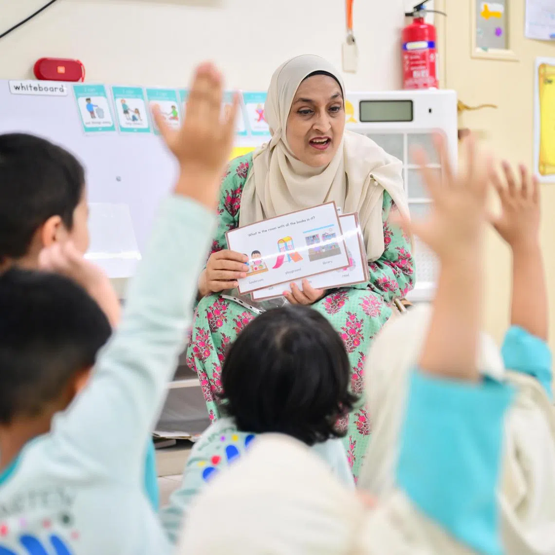 Ms Reema Bhatti, 55, a kindergarten teacher who suffered a stroke, is back at work at Al Istiqamah Kindergarten a month after her recovery. 

ST PHOTO: AZMI ATHNI