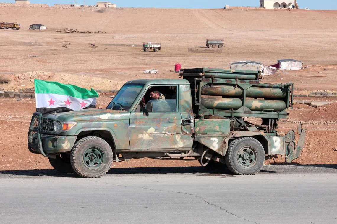 A military vehicle of the Syrian army is parked on the highway near Tabqa, after the Syrian army took control of it, Syria, January 19, 2026. REUTERS/Mahmoud Hassano