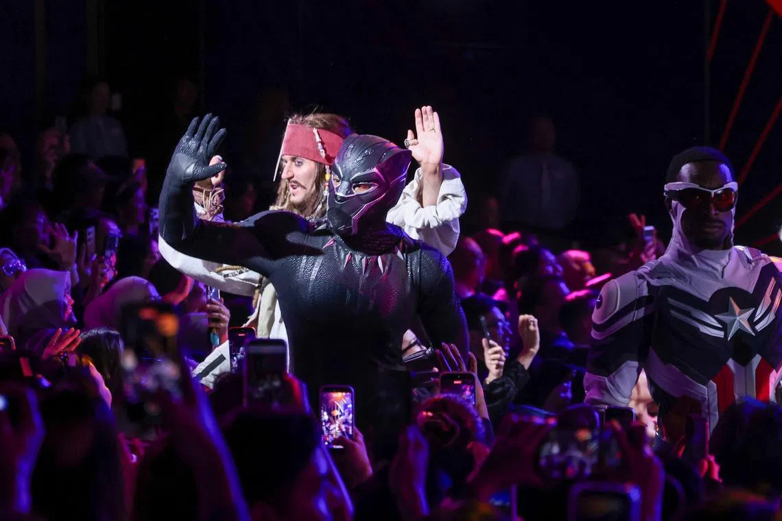 Performers mingling with the audience during the Disney Adventure’s christening ceremony on March 4.