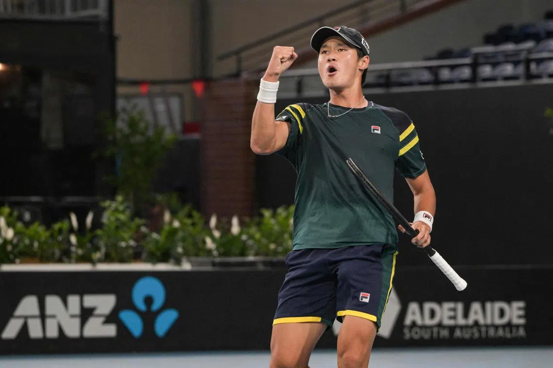 South Korea's Kwon Soon-woo celebrates after winning a game against Spain's Roberto Bautista Agut in Adelaide.