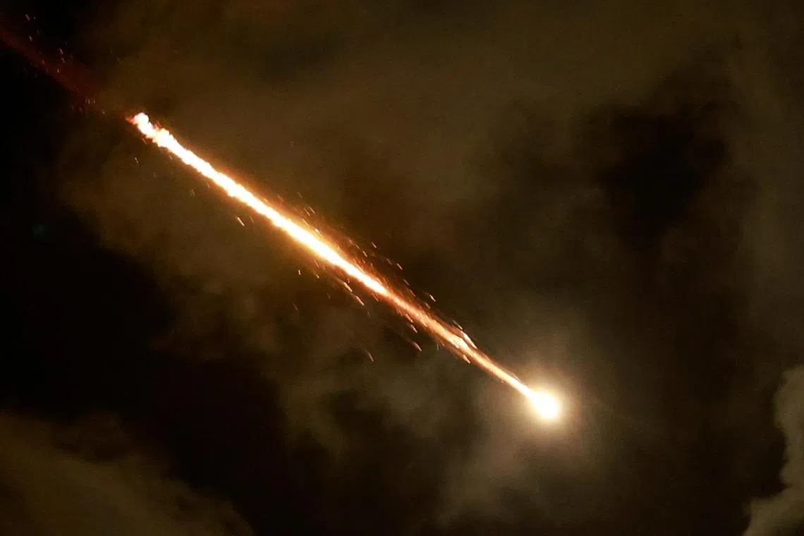 A rocket flying across the sky, as seen from Tel Aviv, Israel, on Oct 1.