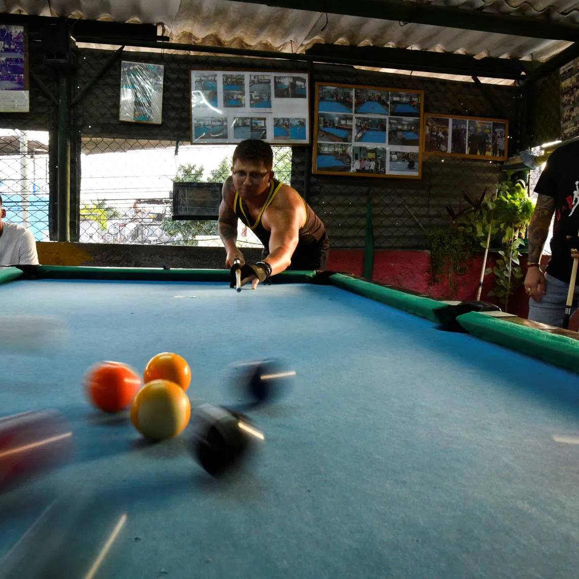 Students play pool at a billiards academy in Havana, Cuba February 17, 2025.  REUTERS/Norlys Perez